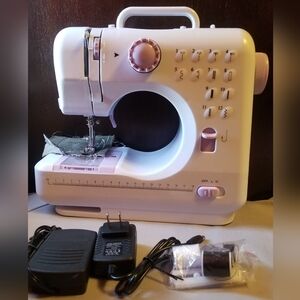 Compact White and Pink Sewing Machine